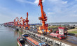 Cranes carry out loading and unloading operations in an orderly manner at the Yaowan Compr...