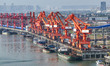 Cranes carry out loading and unloading operations in an orderly manner at the Yaowan Compr...