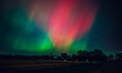The night sky in Wisconsin glows with the Northern Lights as a geomagnetic storm brings vi...