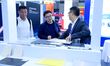 Visitors communicate with exhibitors at the 9th China Advanced Materials Industry Expo 202...