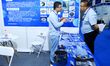 Visitors communicate with exhibitors at the 9th China Advanced Materials Industry Expo 202...
