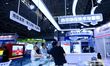 Visitors visit the booths of insoluble metals and rare earth permanent magnets at the 9th...