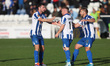 Adam Campbell of Hartlepool United celebrates with his teammates Nathan Sheron and Nicky F...