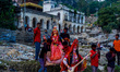Hindu devotees immerse an idol of the Hindu goddess Durga into the Bagmati River in Kathma...