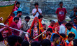 Hindu devotees immerse an idol of the Hindu goddess Durga into the Bagmati River in Kathma...