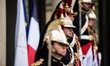 Presidential guards stand at the Elysee Palace during the visit of King Philippe and Queen...