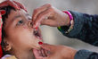 A Nepali child receives a ''Vitamin A'' capsule at an inoculation center in Kathmandu, Nep...
