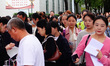 Candidates queue to enter the exam room during the 2024 National Adult College Entrance Ex...