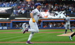 New York Mets player Pete Alonso #20 rounds the bases after hitting a home run during the...