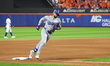 Los Angeles Dodgers player Andy Pages #44 rounds the bases after homering during the fifth...