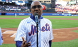 The Temptations sing the National Anthem on the field before Game 5 of a baseball NL Champ...