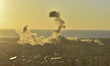 Black smoke billows from Beirut's southern suburb following heavy Israeli air raids on the...