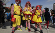 Three people dress as Ronald McDonald during the Zombie March in Mexico City, Mexico, on O...