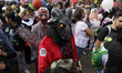 Dozens of people dressed in costume participate in the Zombie March in Mexico City, Mexico...