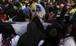 Dozens of people dressed in costume participate in the Zombie March in Mexico City, Mexico...