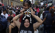 A woman carries her baby during the Zombie March in Mexico City, Mexico, on October 19, 20...