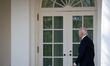President Joe Biden returns to the oval office after addressing senior staff and the natio...