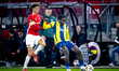 AZ Alkmaar midfielder Sven Mijnans and Fenerbahce forward Bright Osayi-Samuel play during...