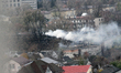 A pillar of smoke rises over a garage cooperative damaged by the Russian missile strike in...