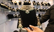 A trader displays diamond jewelry inside a stall at East India's International Gems and Je...