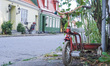 An old town street with bicycles parked in front of buildings is seen in Ystad, Sweden, on...