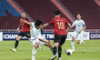 Poramet Arjvirai (R) of Muang Thong United is in action against Chul Soon Choi (L) of Jeon...