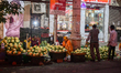 A vegetable seller sells cauliflower at a roadside shop in Kolkata. 