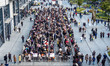 Customers line up in front of a Pangdonglai (DL) store in Xuchang, China, on December 7, 2...