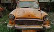 An abandoned iconic yellow Ambassador taxi is seen in Kolkata, India, on December 13, 2024...