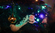 A Santa Claus bauble on a Christmas tree is seen in Knurow, Poland, on December 23, 2024. 