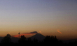 The Popocatepetl Volcano in Mexico erupts during sunrise on December 27, 2024. 