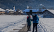 Locals and tourists take a winter walk in Krun, Garmisch-Partenkirchen, Upper Bavaria, Bav...