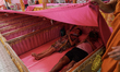 Thai devotees lie inside a coffin as a Buddhist monk officiates a ritual believed to help...
