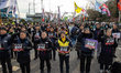 Members of the Korean Confederation of Trade Unions (KCTU) and citizens hold a protest nea...