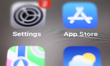 Settings and App Store icons are seen displayed on a phone screen in this illustration pho...