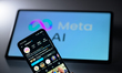 The Instagram app displays on a mobile phone with the Meta AI logo visible on a tablet scr...