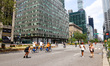 People walk, run, and ride bikes during New York City's Open Streets on Park Avenue in the...
