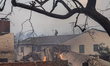 A firefighter is seen as the wildfires continue in Pacific Palisades, California, on Janua...