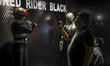 A fan of the Kamen Rider drama series takes a photo with the Kamen Rider replica during th...