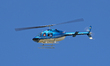 A Bell 206B-3 JetRanger III of BG Helicopters flies over Barcelona, Spain, on June 21, 202...