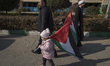 Iranian children carry Palestinian flags at the Imam Khomeini Grand Mosque before particip...