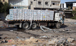 Trucks carrying humanitarian aid arrive in the Gaza Strip via the Kerem Shalom crossing, a...