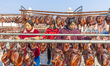 Workers dry cured fish at an aquatic product processing base in Suqian, Jiangsu province,...
