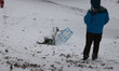 A child slides down a hill during a snowstorm in Houston, Texas, on January 21, 2025. 