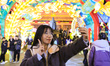 Tourists view festive lanterns at the Confucius Temple scenic spot in Nanjing, China, on J...