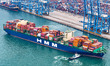 A foreign trade container ship leaves the fully automated terminal of Qingdao Port in Shan...