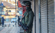 An Indian security personnel guards along a road in Srinagar, Jammu and Kashmir, on Januar...
