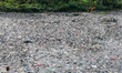 Officers clean up piles of trash in the Citarum River in Bandung, Indonesia, on January 27...