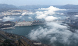 An aerial photo on January 26, 2025, shows the Three Gorges Dam shrouded by clouds in Maop...