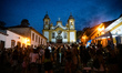 People stand in front of the Igreja Matriz de Santo Antonio (Church of Saint Anthony) in T...